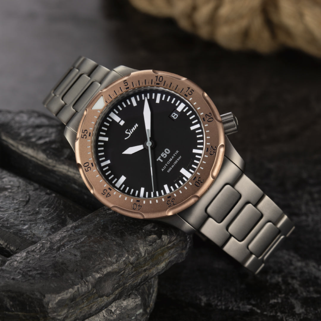 SINN T50 GBDR Watch - The H-Link Bracelet sets this chronograph apart from the rest. It's a durable, stylish watch to own. We’ve got it in stock, so don’t wait! Click the link below to buy now!